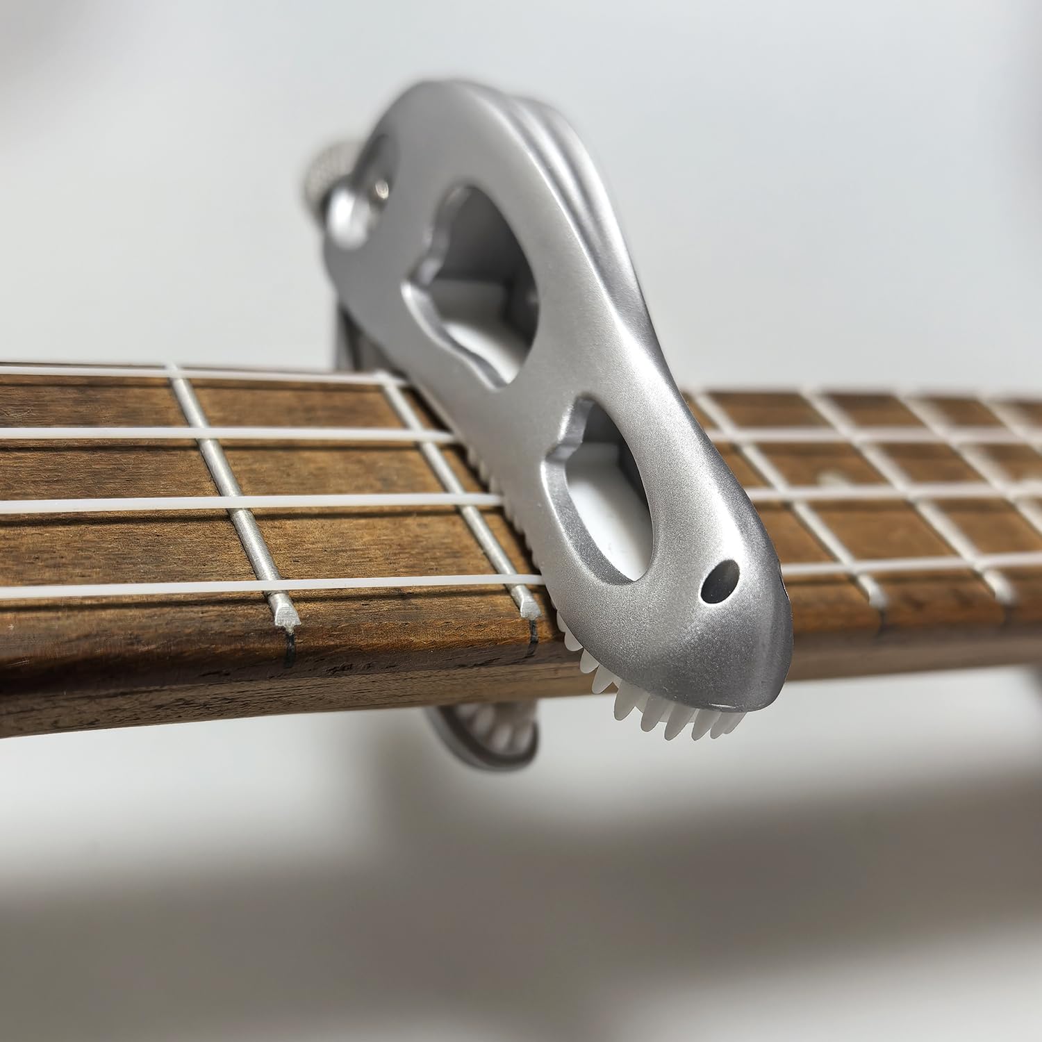 Prehistoric T-Rex Guitar Capo – Dinosaur Skull Design with Silicone Teeth, Zinc Alloy Adjustable Clamp for Acoustic/Electric Guitar, Bass, Ukulele & Banjo (Silver)